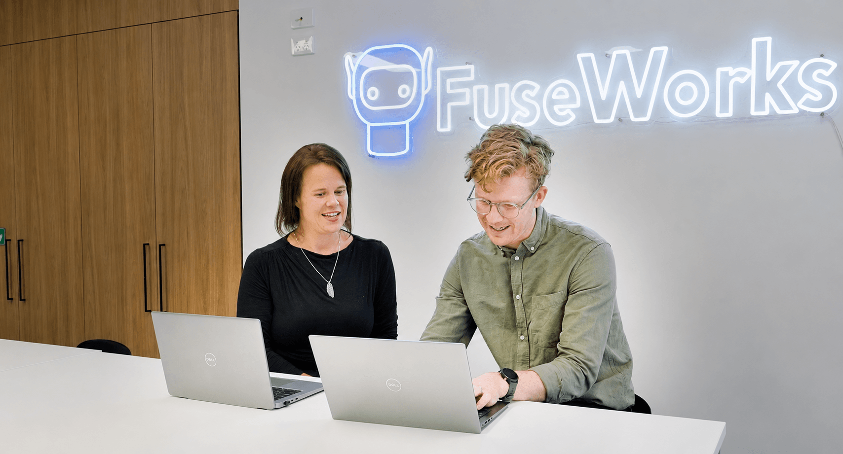 Colleagues working together at a desk